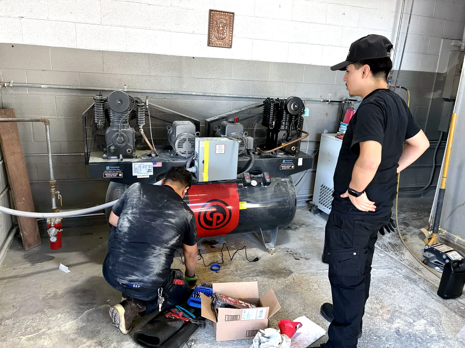Toolytics Industrial team repairing a Chicago Pneumatic duplex compressor system